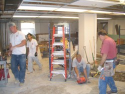 Photo of construction workers in dorm basement