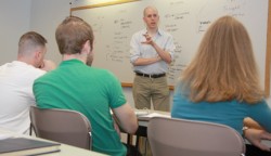 Photo of John August speaking to class.