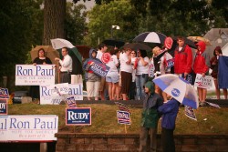 Photo of supporters with signs outside presidential debate