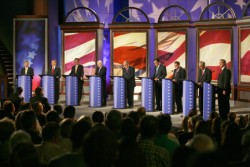Photo of nine candidates on stage.