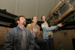 Photo of people looking through telescope at Drake Municipal Observatory