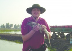 photo of Stephen Lauer holding fish.