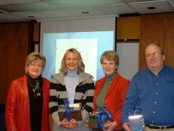 Dean Janet McMahill presents recognition gifts to Resource Center staff members Deb Thomas, Marion P