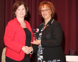 photo of Jennifer Fix accepting Alumni award