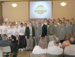 Photo of team members in City Council chambers.