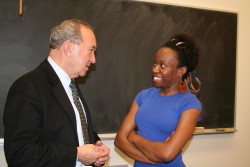 photo of Richard Goldsone talking to law student Theresa Hassler