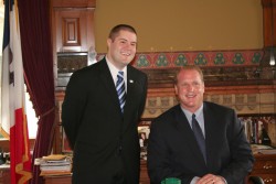 photo of Law student Sean Bagniewski chats with Gov. Chet Culver after the bill signing.