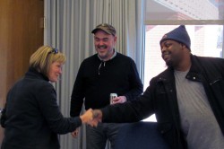 GED Instructor Barb Hoffman and Adult Literacy Center Reading Tutor Bill Barnes congratulate Mike Woods on his accomplishment.