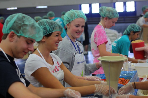 Drake students package meals for "Meals from the Heartland," an Iowa-based nonprofit that combats food insecurity in Iowa and abroad.
