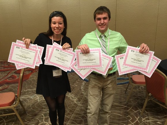 Editor-in-chief Courtney Fishman, left, and photo editor Joel Venzke with the 12 Times-Delphic awards.