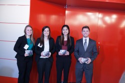 Students from Drake University Alyssa Mougin (left) and Joey Gale (right), with their Creighton teammates accept the runner-up award in this year's Murphy Cup strategic marketing competition. 