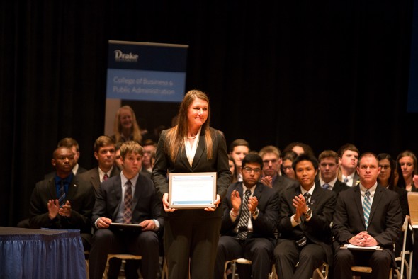 Kathryn Clausen of Hinton, Iowa, receives the Junior Student of the Year Award from the Drake University College of Business and Public Administration.