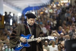 President Maxwell performs at spring 2015 commencement on a custom guitar created by Bilt Guitars of Des Moines.