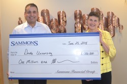 Esfand Dinshaw, Chairman and Chief Executive Officer for Sammons Financial Group, presents a $1 million check to Therese M. Vaughan, Ph.D., Dean, College of Business and Public Administration at Drake University, to fund the Sammons Endowed Professorship in Actuarial Science.