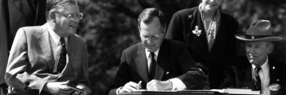 President Bush signs the Americans with Disabilities Act on July 26, 1990.