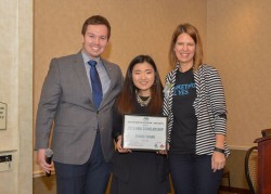 Drake junior Eunice Chang (center), recipient of the 2015 Iowa AMA Scholarship, poses with Tom Florian, director of collegiate and member relations for the Iowa AMA, and Iowa AMA President Kendra Kelly.