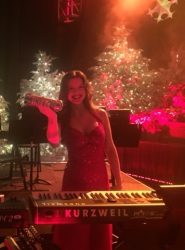 A photo of Anna Lackaff, adjunct instructor of music at Drake University, who will tour the country as keyboardist for Mannheim Steamroller this holiday season.