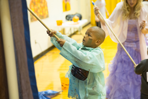 Boy participating in Halloween Hoops activity