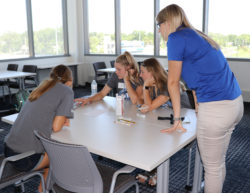 Students calculating dosage in Pharmacy lab