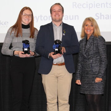 Third-year student pharmacists Shannon Dicken and Peyton Braun presented with the 2023 Granberg Awards by dean and professor Renae Chesnut during Health Professions Day.