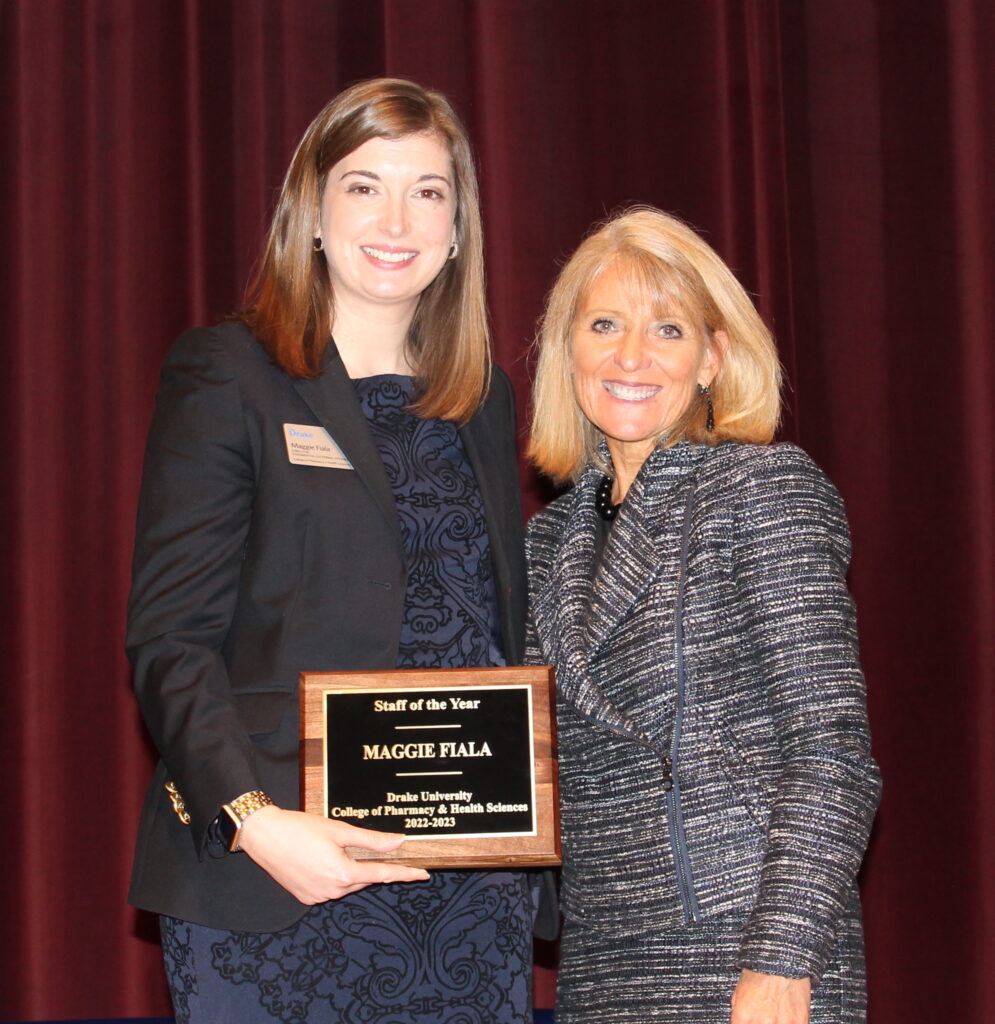 Maggie Fiala, Staff member of the year poses with dean of the College, Renae Chesnut.