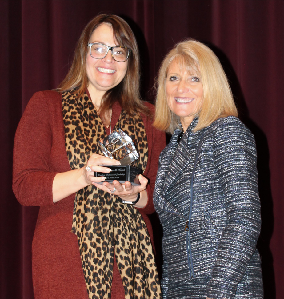 Rachel Allen-McHugh, C. Boyd Granberg Professional Leadership Awardee, poses with dean of the College Renae Chesnut.