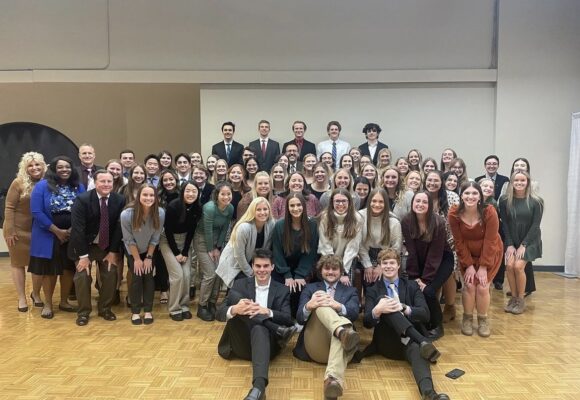 Student, faculty, and alumni members of Phi Delta Chi's Psi Chapter at Drake pose for a photo during its 18th annual Awards Banquet on Nov. 6, 2023.