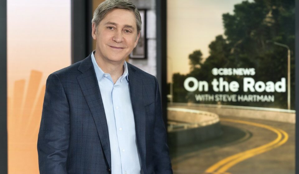 Steve-Hartman Steve Hartman standing in front of a "CBS News On the Road with Steve Hartman" background.