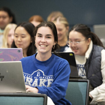 Drake Health Sciences student works on her laptop during a lecture