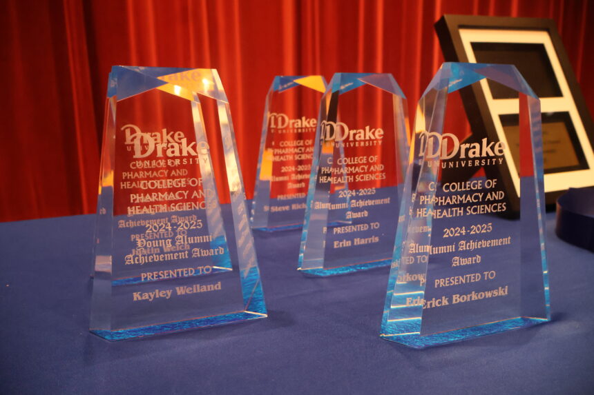 Glass Alumni Achievement award trophies sitting on table