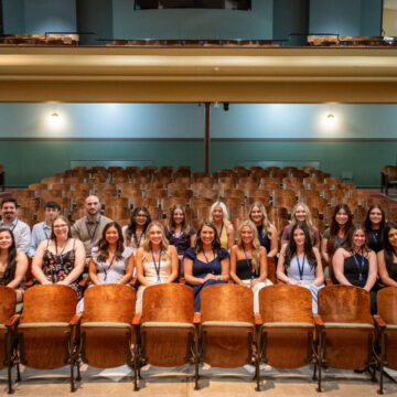_DSC3817 (2) Drake Nursing Class of 2026 poses together wearing their pins in Sheslow Auditorium